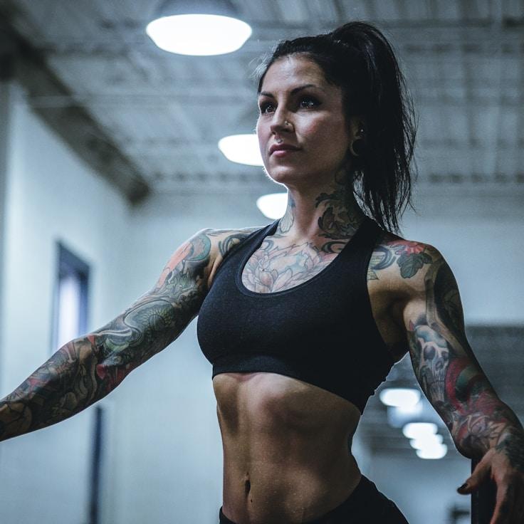 Participants in a class performing stretches and mobility work